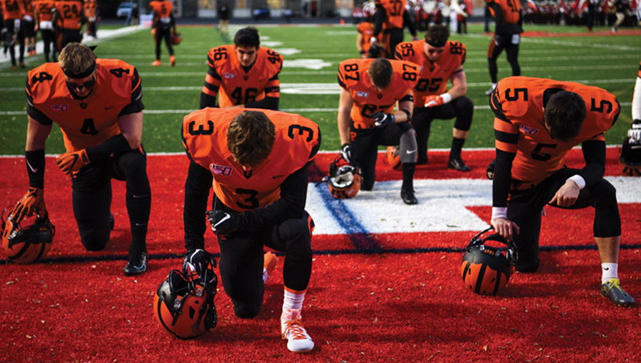 It is tradition for a group of Princeton football players to kneel in prayer prior to each game. The Tigers emerge from the tunnel and head to the end zone, where they reverently bow their heads.