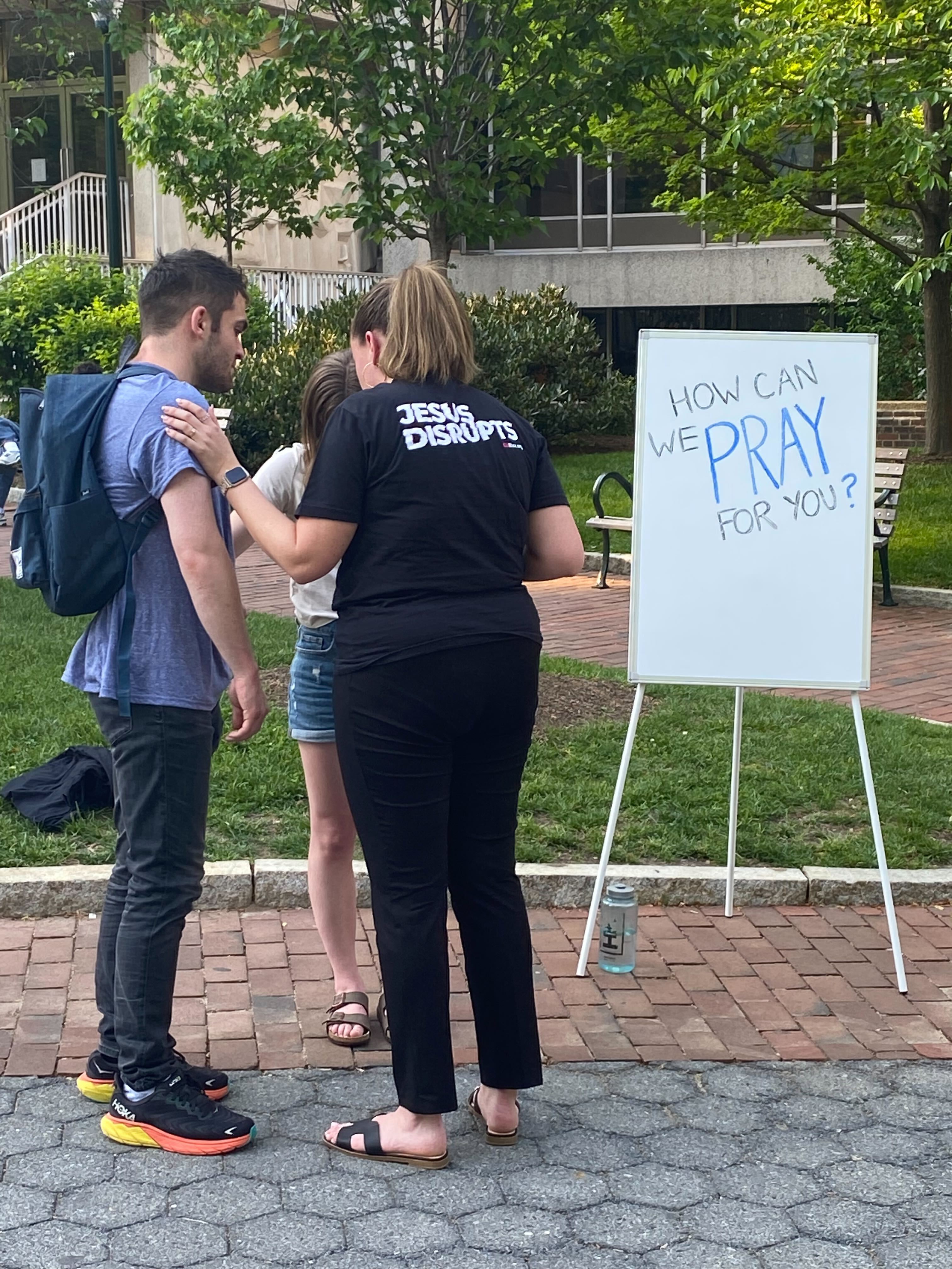 penn leader praying during protest